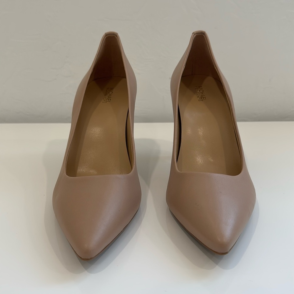 Brand new Michael Kors 3” nude leather pumps. Size 10M